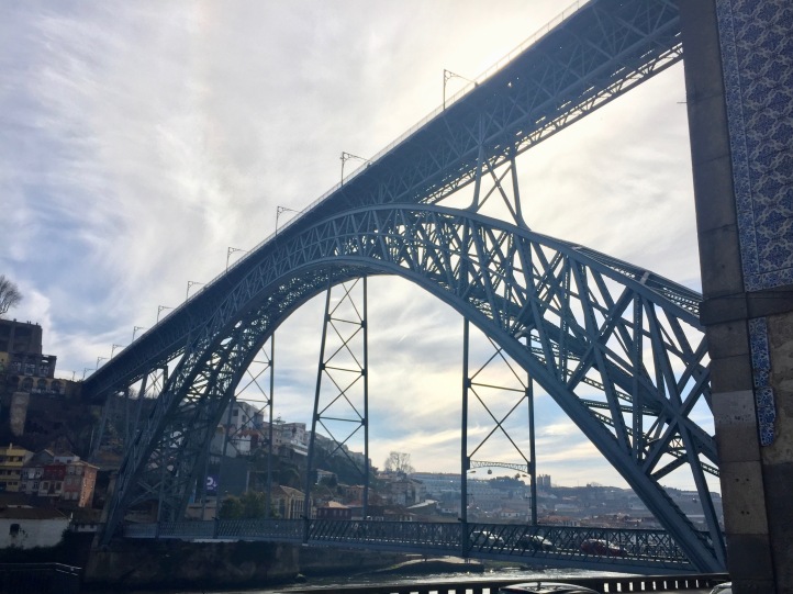 The Luis I Bridge is extremely large in comparison to the river and town.