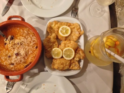 A delicious traditional Portuguese dinner of beans and rice, cod and white sangria.